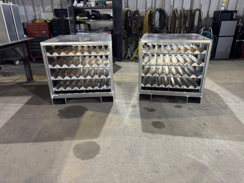 Front view of two shelved aluminum cabinets