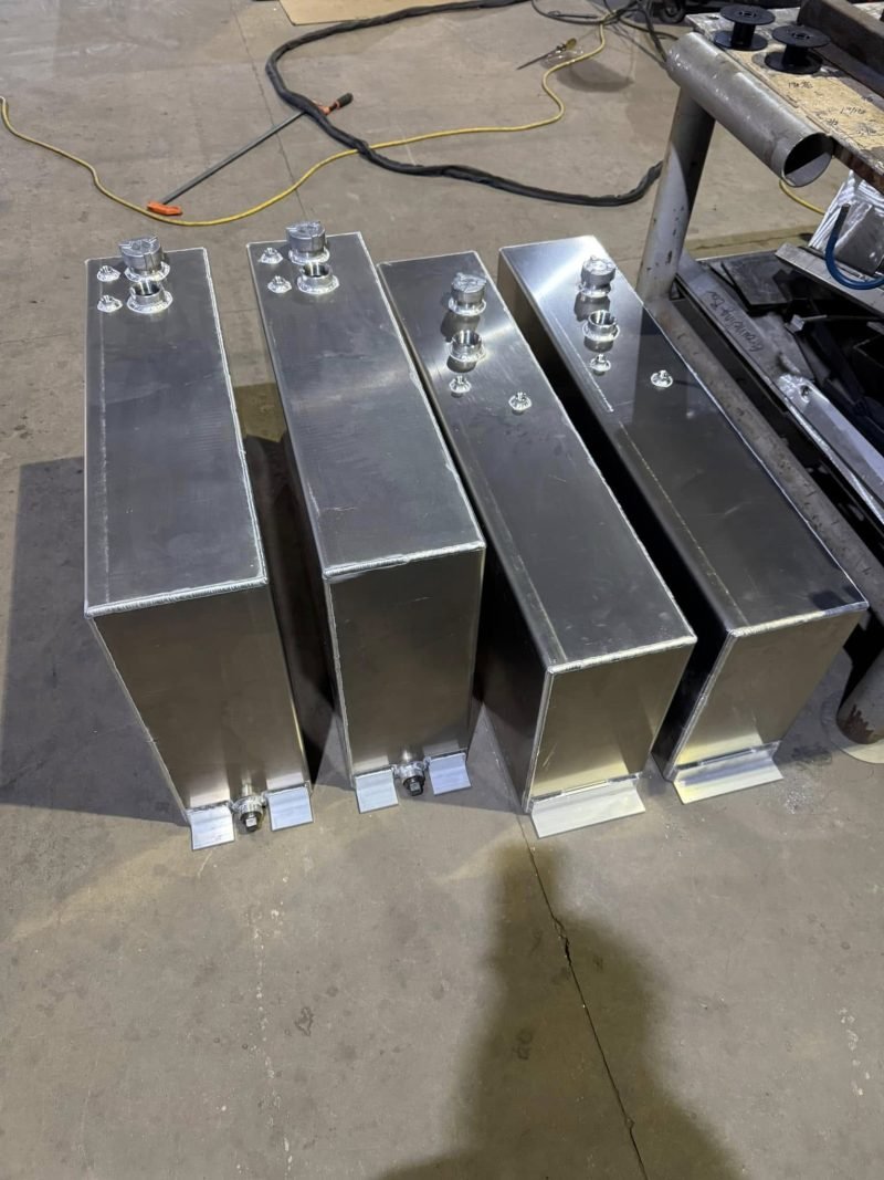 Welded aluminum tanks with top fittings