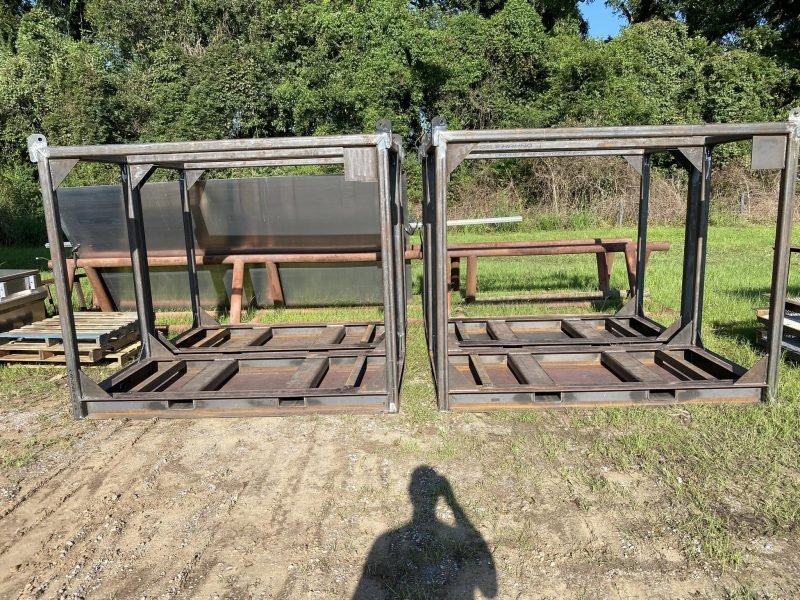 Steel skid frames with side panels staged outside