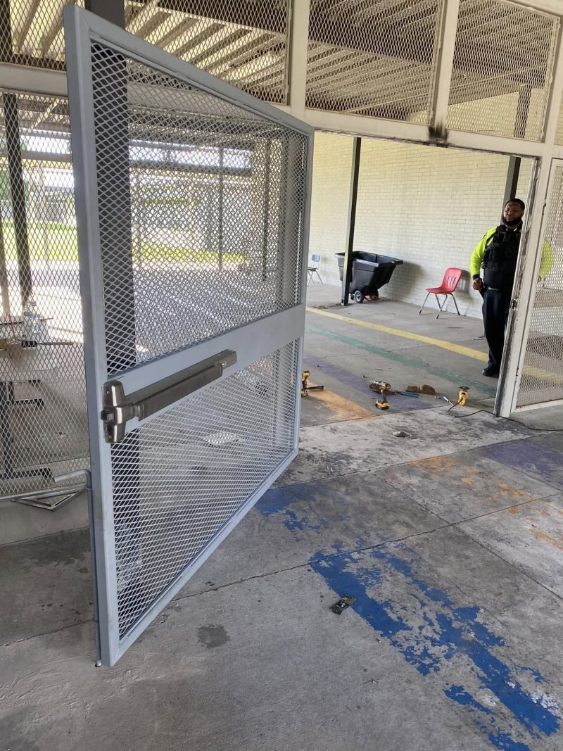 Welded wire mesh security gate installed in a building