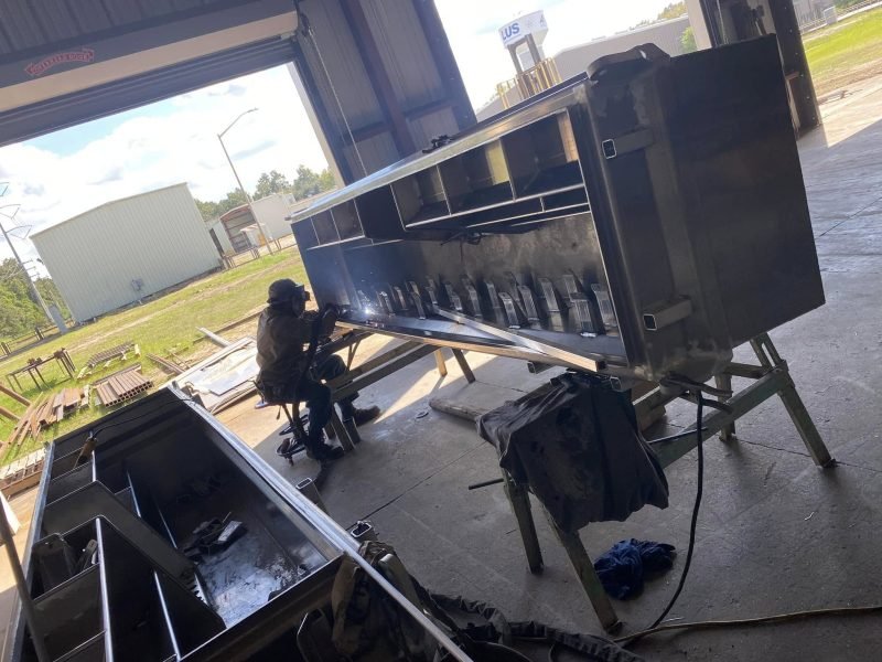 Welding an aluminum toolbox outside the shop