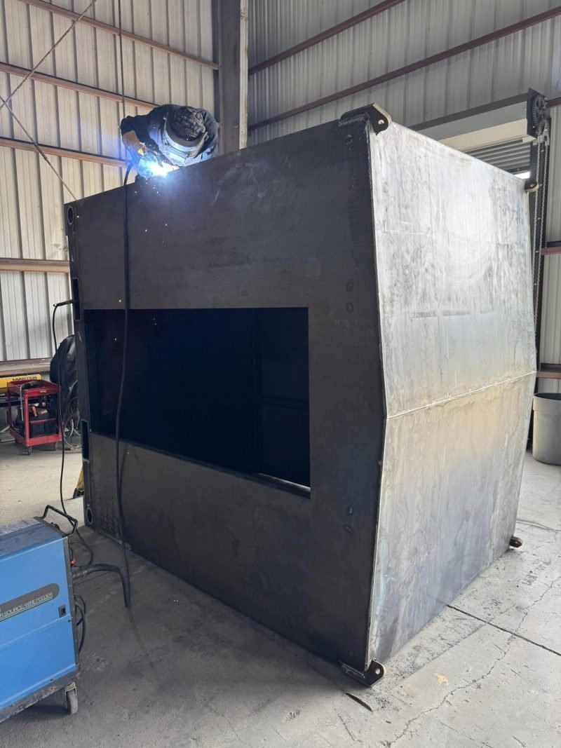 Welding a panel on a steel enclosure