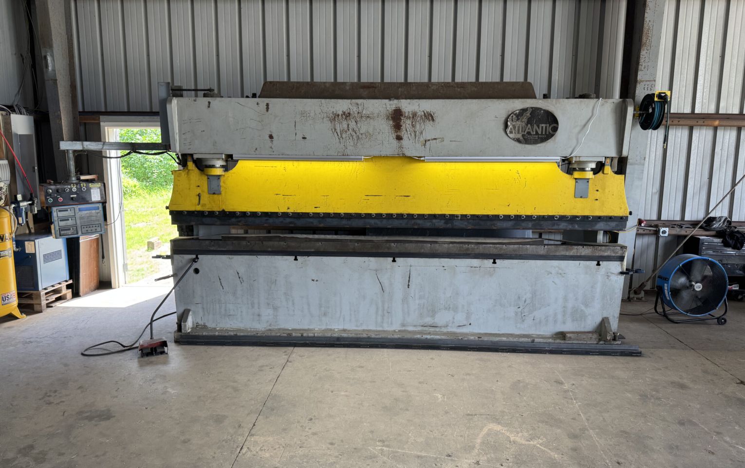 Industrial press brake machine performing metal bending at H&L Fabrication